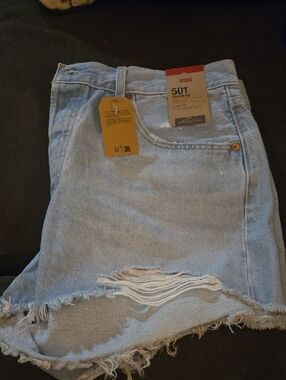 Levi's light blue distressed denim shorts with frayed hem